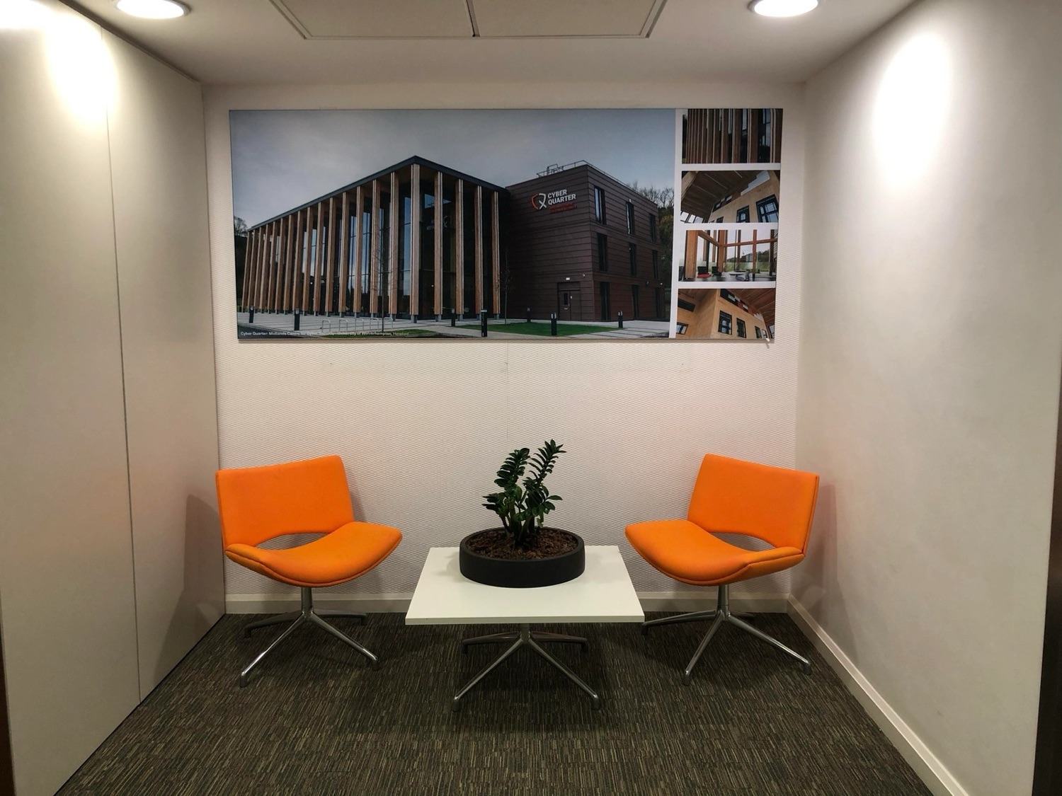 Mounted display board of a building in a breakout meeting room