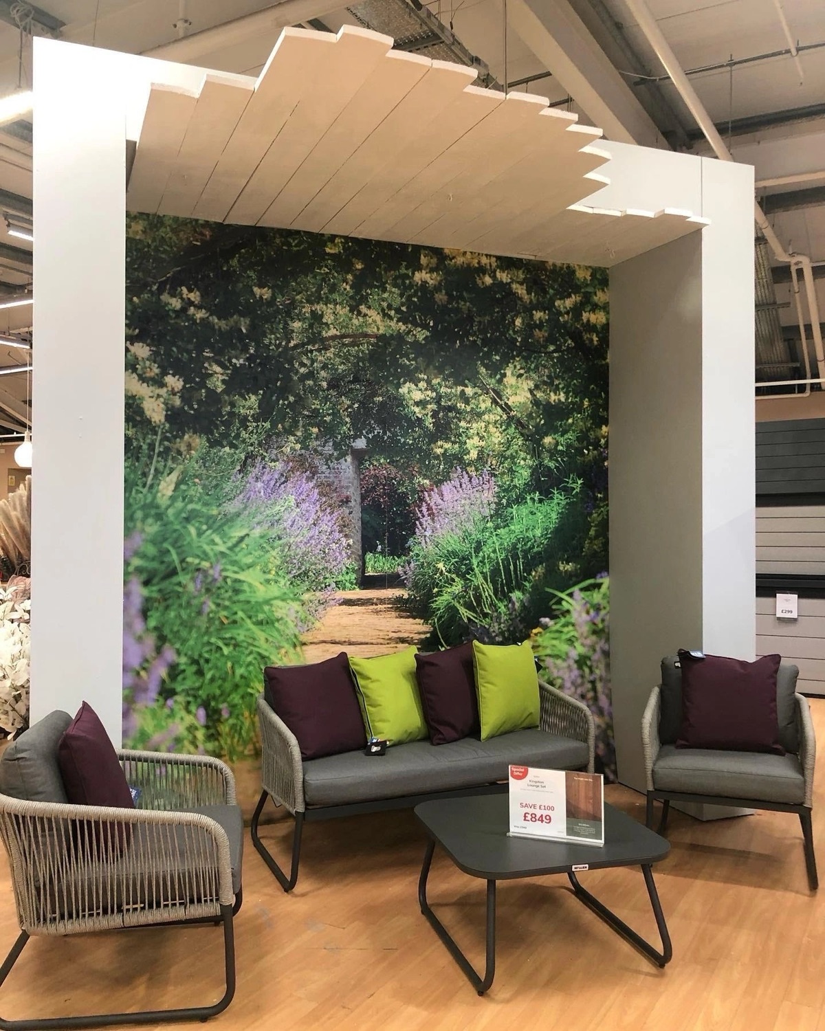 Large-format printed wallpaper of an English garden in a retail showroom